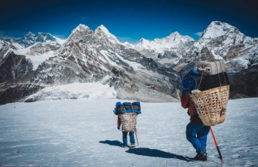 Porter carrying heavy loads in Himalayas of Nepal