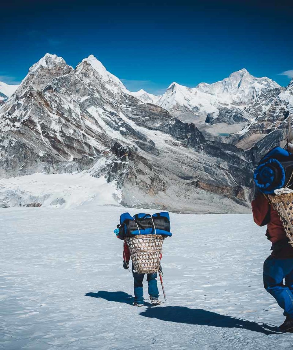 Porter carrying heavy loads in Himalayas of Nepal