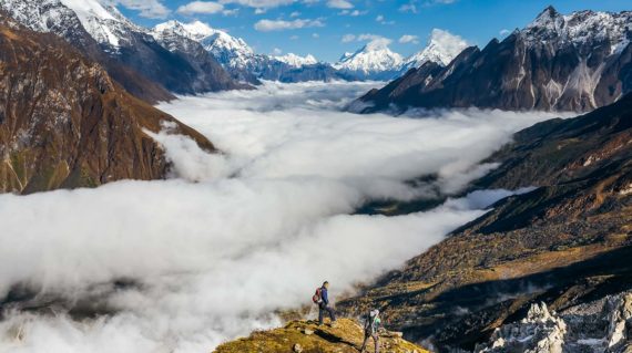 Trekker on the way to the valley covered with cloud on Manaslu circuit trek in Nepal