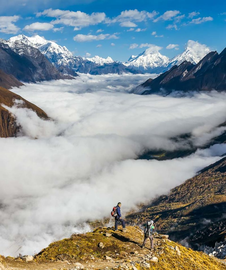 Trekker on the way to the valley covered with cloud on Manaslu circuit trek in Nepal