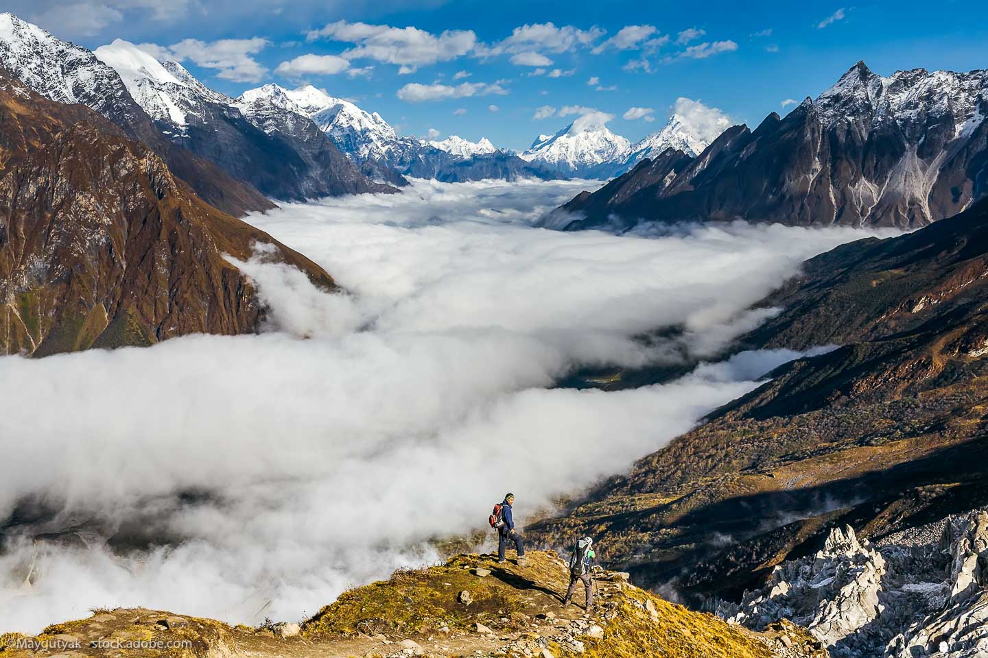 Trekker on the way to the valley covered with cloud on Manaslu circuit trek in Nepal