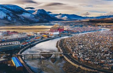 Landscape View of the Yarchen Gar Monastery with many shacks for monks in Garze Tibetan,Sichuan,China. There is The Giant Monasteries of Kham &the largest concentration of nuns and monks in the world.