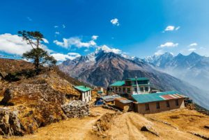 District Namche Bazar. Everest track. Nepalese village and lodge. Behind the village there is a view of Mount Thamserku